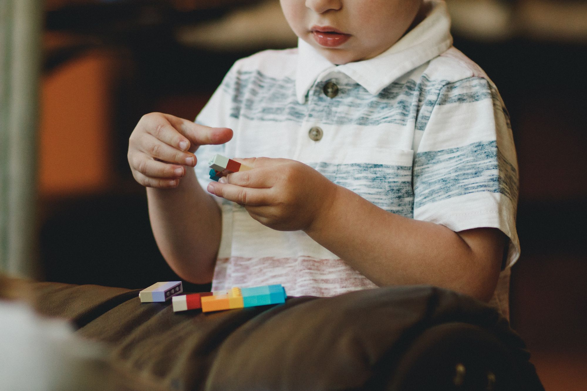 boy holding lego block 